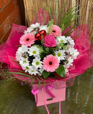 Pink germini flowers with white chrysanthemums and pink roses
