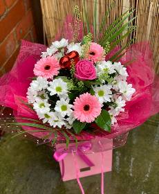 Pink germini flowers with white chrysanthemums and pink roses