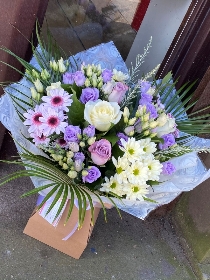 Lilac and cream dream bouquet. Lilac lisianthus, cream roses and chrysanthemums. Boxed bouquet in water