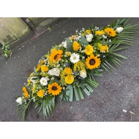 Yellow casket spray